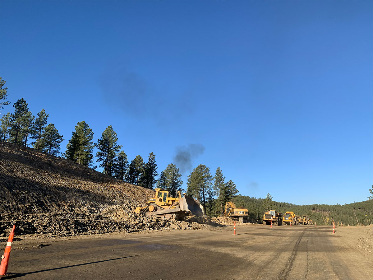 Construction equipment doing earthwork.